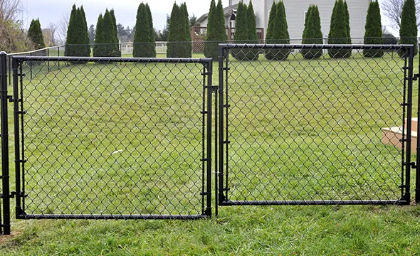 Barbed wire and chain link field fence offering strong security and protection for large properties.