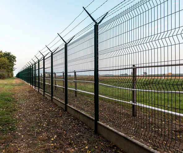 Commercial field fencing installation providing strong, secure, and efficient solutions for large properties.